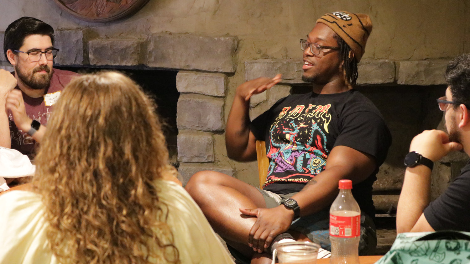 Dropout TV’s Ify Nwadiwe holds court during his office hour in the pub of Ravenwood Castle at Champions Grove 2024